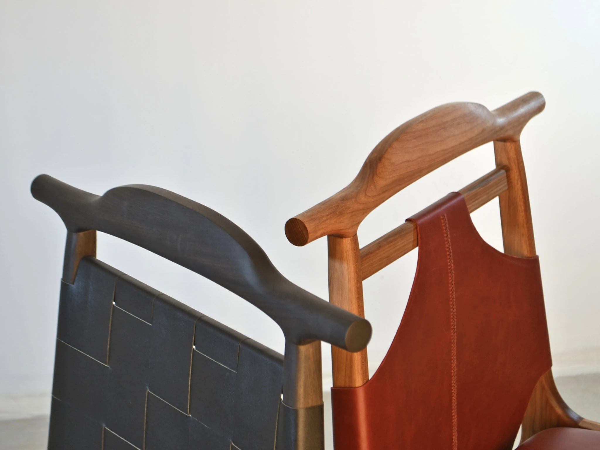 Nadyr Chair in both versions, ebonized and natural, side by side